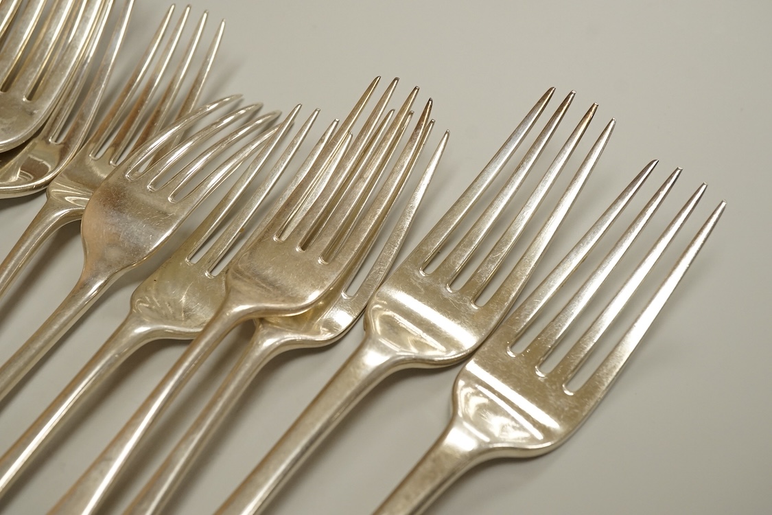 A set of eight George IV silver Hanoverian pattern table forks by Eley & Fearn, London, 1821, three other similar table forks and a set of eleven Victorian silver Hanoverian pattern dessert forks, George Adams, London, 1